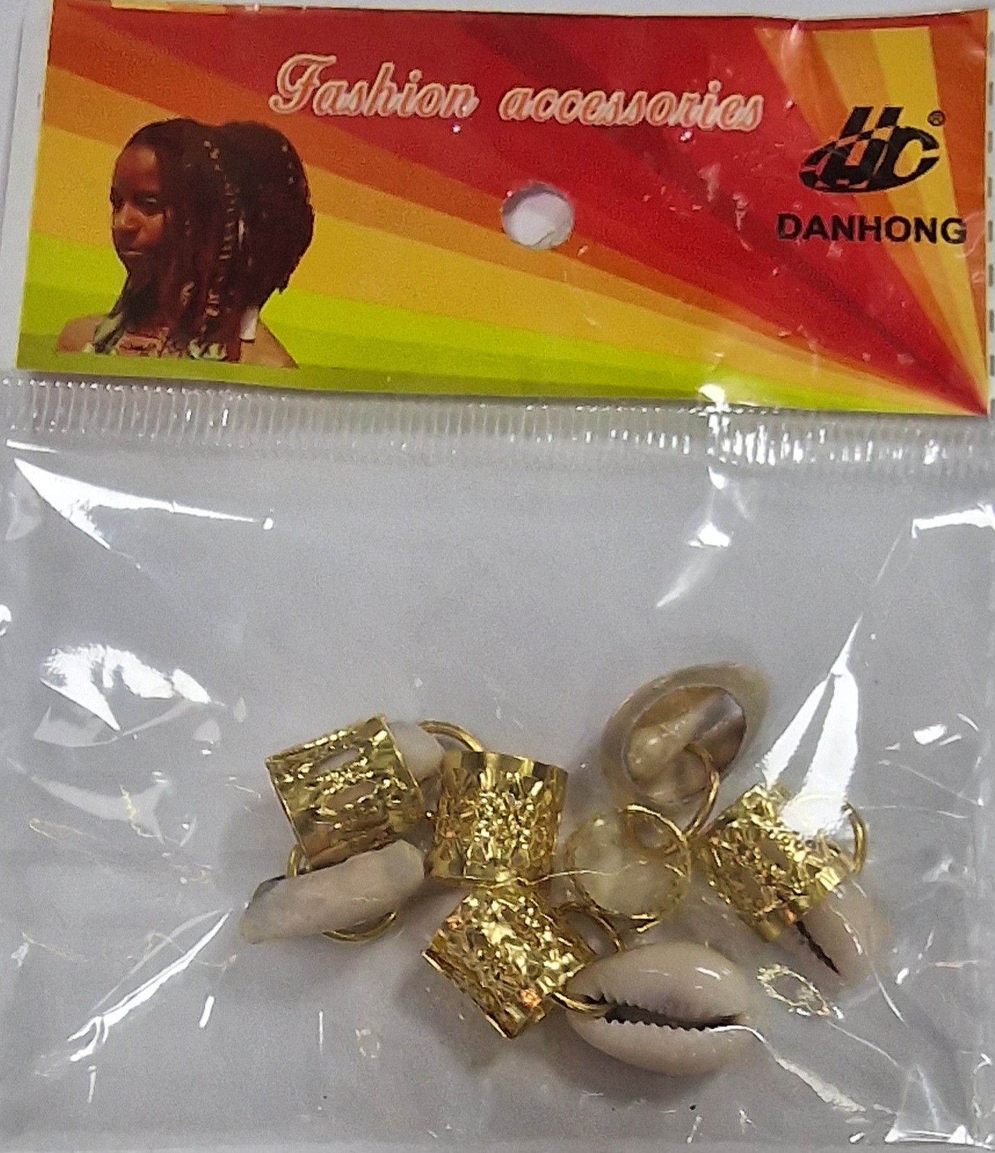 Bagues pour cheveux dor\u00e9e et coquillages